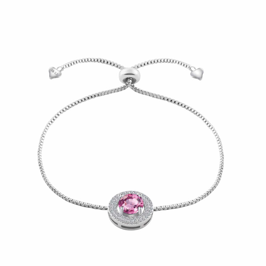 rhodium plated adjustable bracelet featuring a large pink simulated sapphire and smaller clear cut gemstones