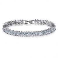 Silver toned tennis bracelet decorated with 40 clear cut gem stones