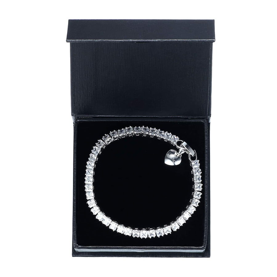 7CT SIMULATED SAPPHIRE RHODIUM PLATED TENNIS BRACELET WITH HEART CHARM