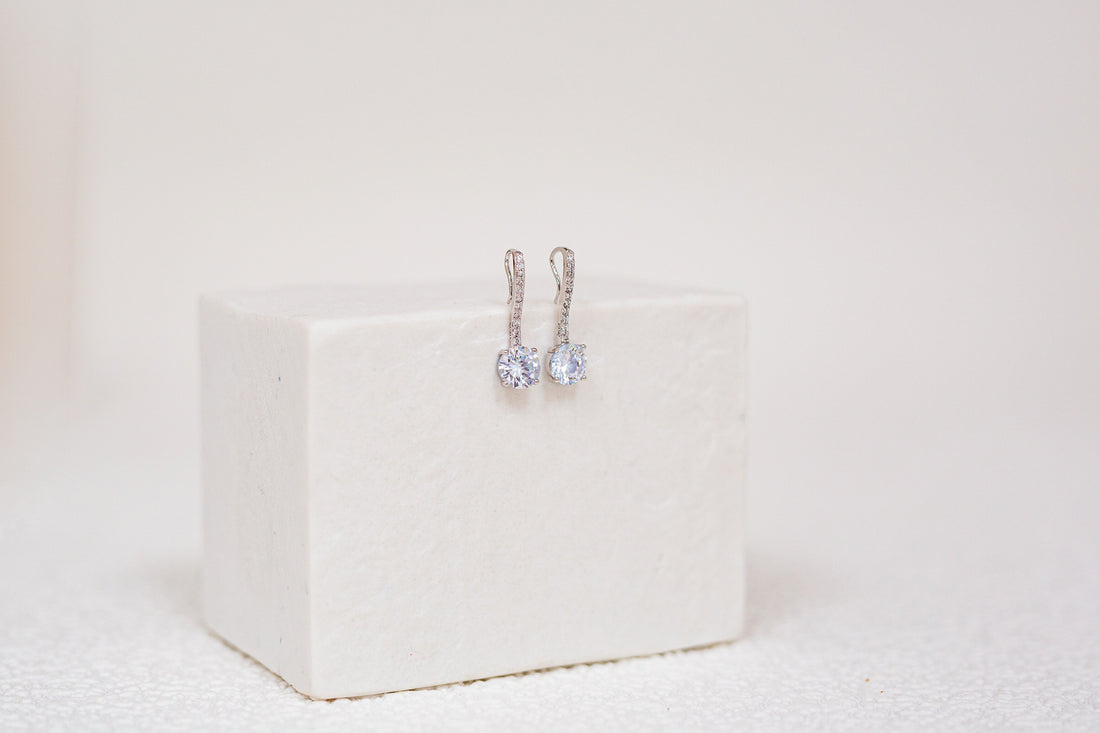 3.0 CTTW Synthetic Sapphire Clear Drop Rhodium Plated Earrings