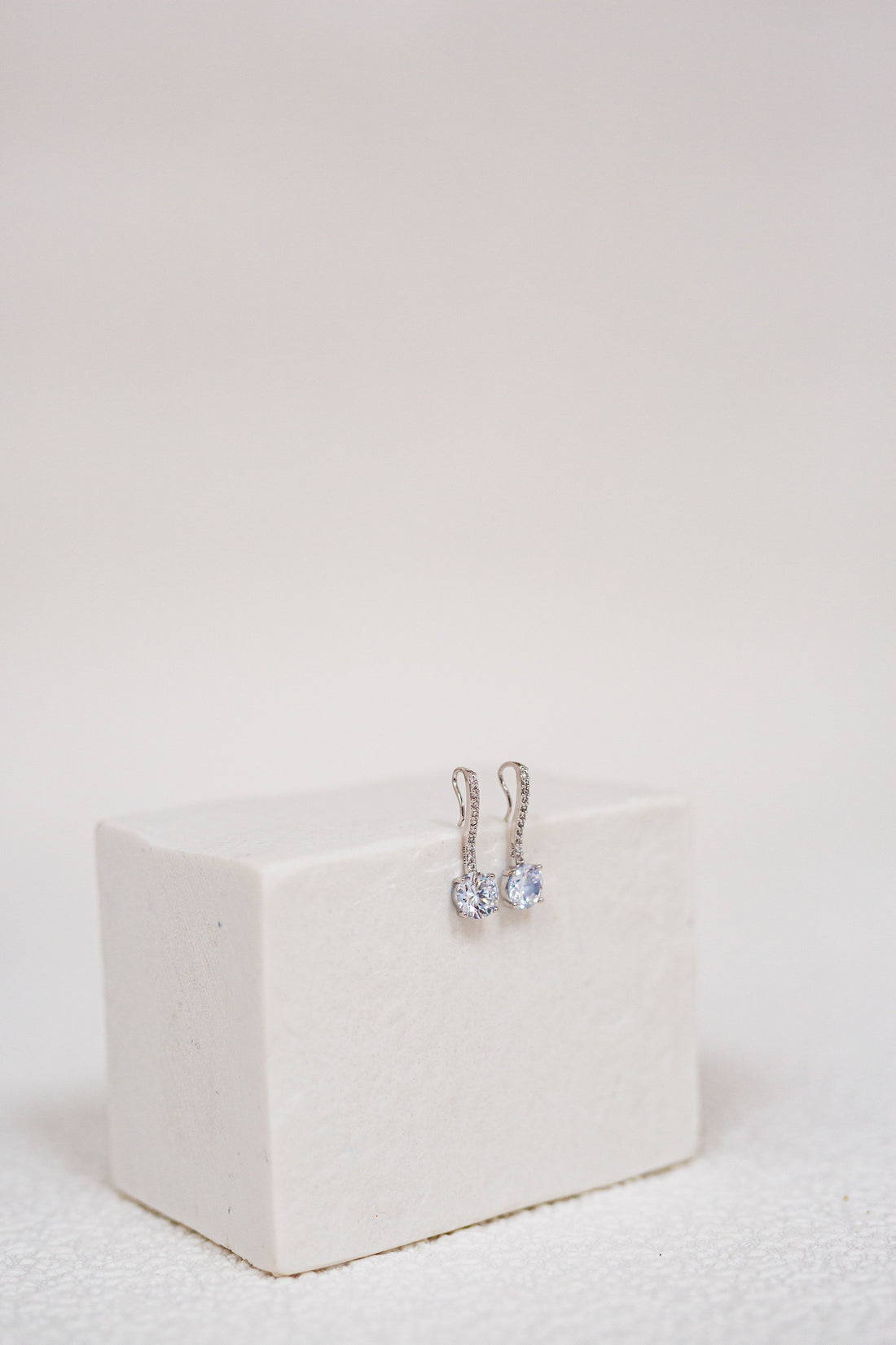 3.0 CTTW Synthetic Sapphire Clear Drop Rhodium Plated Earrings