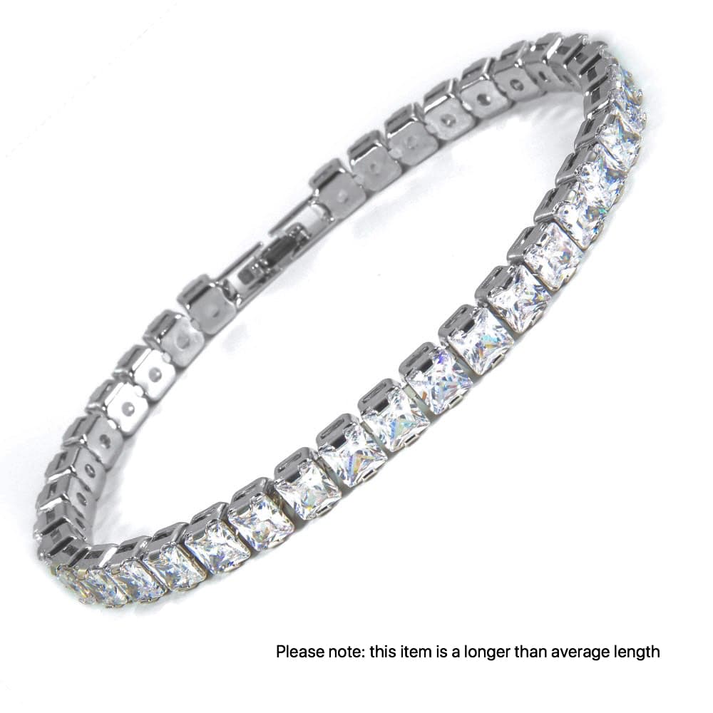 Silver toned rhodium plated bracelet featuring square cut, clear crystals finished with a secure and subtle clasp.