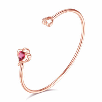 Rose gold bangle featuring pink Swarovski® crystal and clear natural diamond